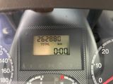 a close up of a digital clock on the dashboard of a car
