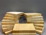 several books stacked on top of each other on a table
