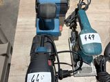 several electric tools are sitting on a table in a workshop