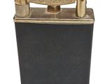 an antique brass lighter with a black case and brass fittings