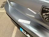 a close up of a car with a badge on it