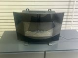 an image of a microwave on a table in a room