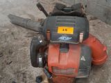 an image of a lawn mower that is sitting on the ground