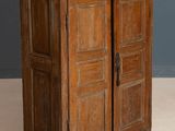 an old wooden cabinet with two doors and two drawers