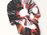 a picture of a mask with a skull on it