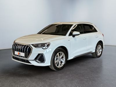 a white audi suv parked in a white room
