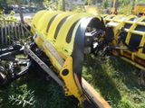 a yellow and black machine that is sitting in the grass