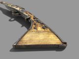 a very old gun that is on display on the table