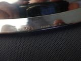 a person holding a knife in their hand on a table