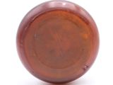a close up of a brown object on a white surface