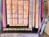 a box full of old books sitting on a table