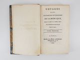 an old book opened to show the title of a novel