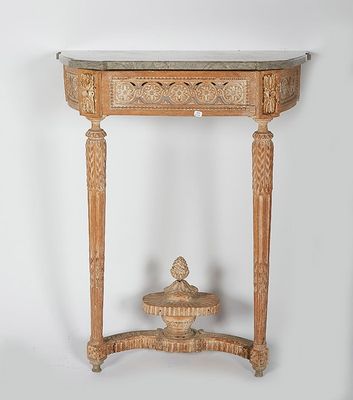 an old wooden table with a marble top and a vase on top of it