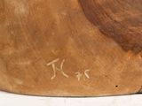 a close up of a piece of wood with writing on it