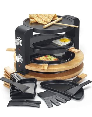 an image of a toaster oven with a variety of cooking utensils