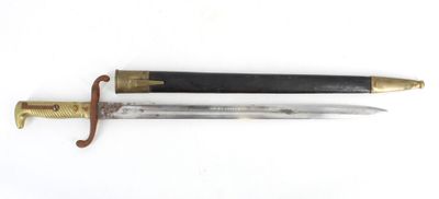 an old knife with a wooden handle and a brass handle