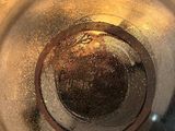 a close up of a glass with a liquid inside of it