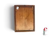 a picture of a wooden box with a tag on it