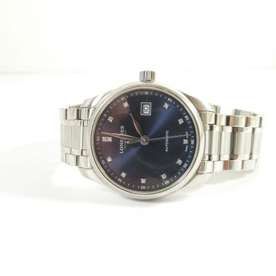 a close up of a watch with a blue dial