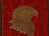 un livre rouge avec un aigle doré sur la couverture