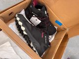 a box with a pair of shoes inside of it