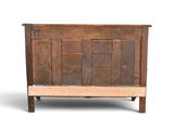 a wooden bed with a wooden headboard and foot board