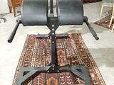 an image of a black chair on a rug in a living room