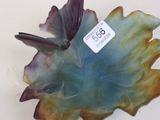 a blue and green leaf shaped bowl with a tag on it
