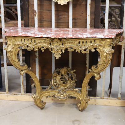 a small table with a clock on top of it