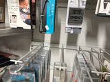 many electronic devices on the shelves in the store