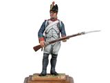 a statue of a man in uniform holding a rifle on a wooden base
