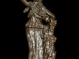 an image of a bronze statue of a woman with a dog