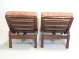 two chairs that are next to each other on the floor