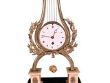 a clock that is sitting on a stand with a clock on it