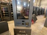 a large display of glass croub machines in a warehouse