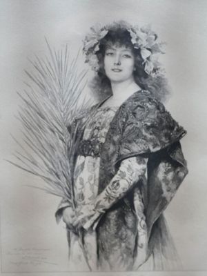 an old picture of a woman in a kimono with a fan