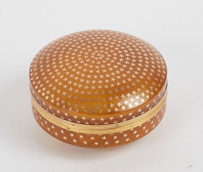 an image of a round box with stars on it on a white surface