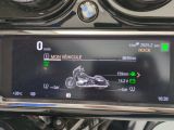 the dashboard of a motorcycle with a digital display showing the speed of the bike