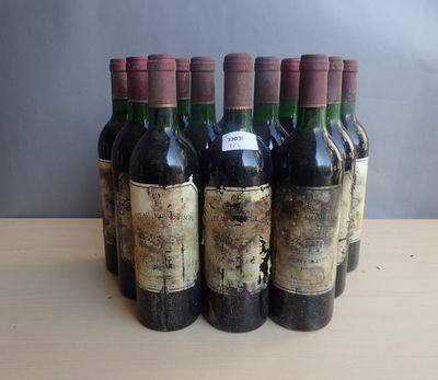 several bottles of wine are lined up on a wooden table