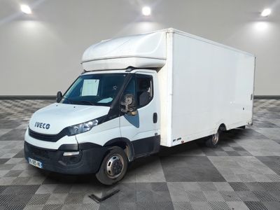 a white truck that is parked on a checkered floor