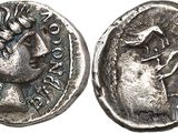 a close up of a silver coin with a man on it