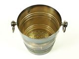 a metal bucket with a handle on a white surface