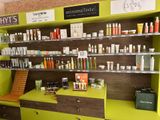 many different types of skin care products displayed on the shelves