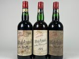 three bottles of wine sitting next to each other on a table