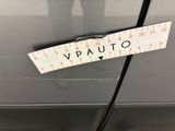 a close up of a car with a ruler attached to the side of it