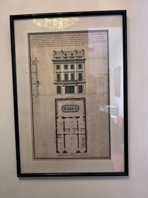 a picture of a drawing of a building on the wall