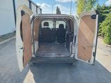 a white van with its doors open on the street