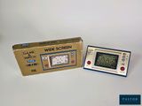 an old game console with a box and instructions on it