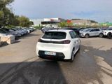 a white car parked in a parking lot next to other cars