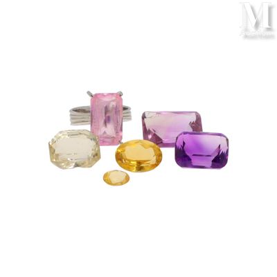 a group of different colored gems on a white background